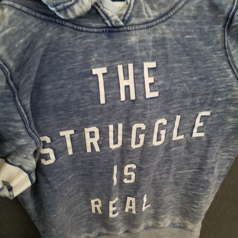 Light blue and white hoodie.